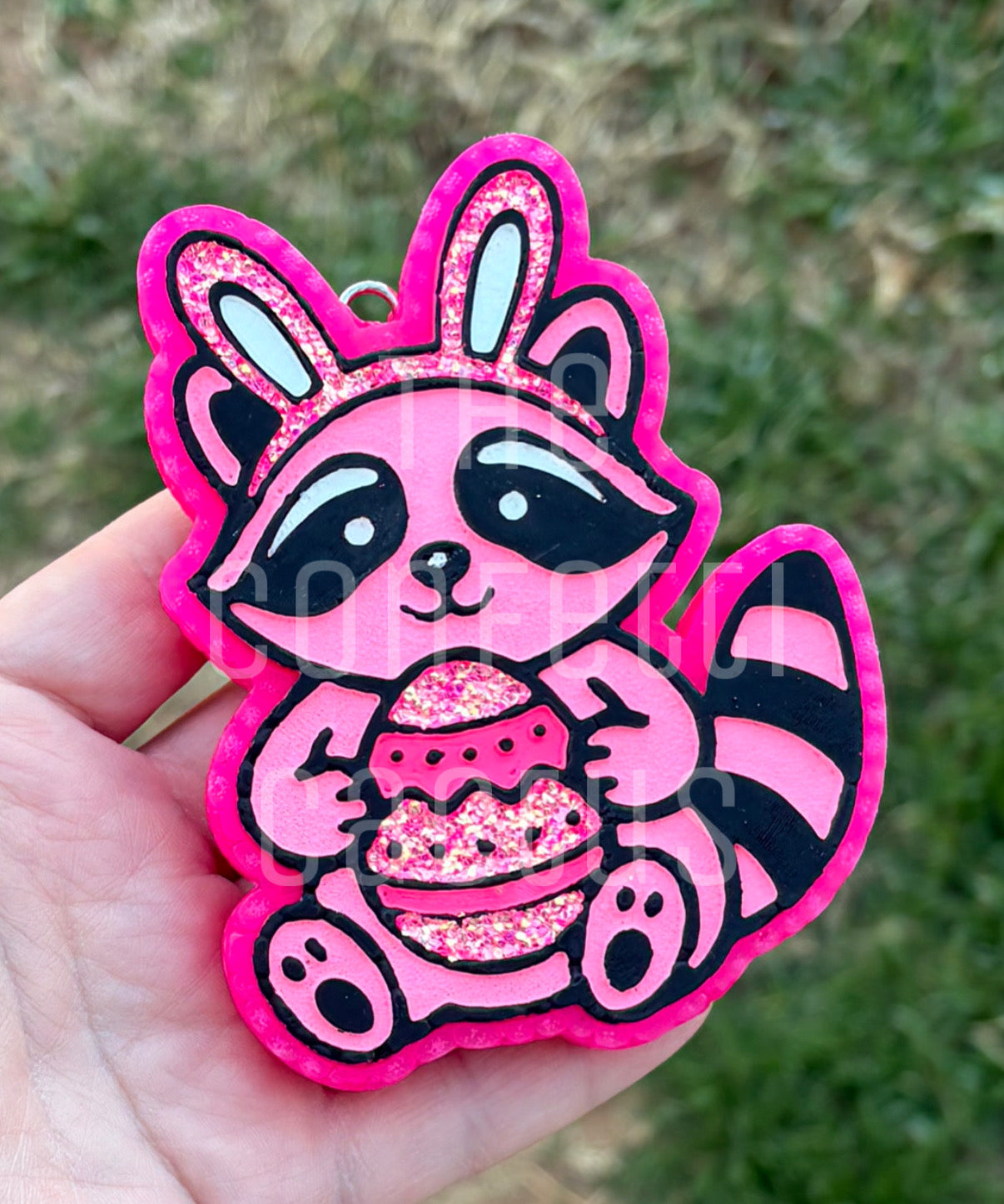 Raccoon holding an Egg with Bunny Ears