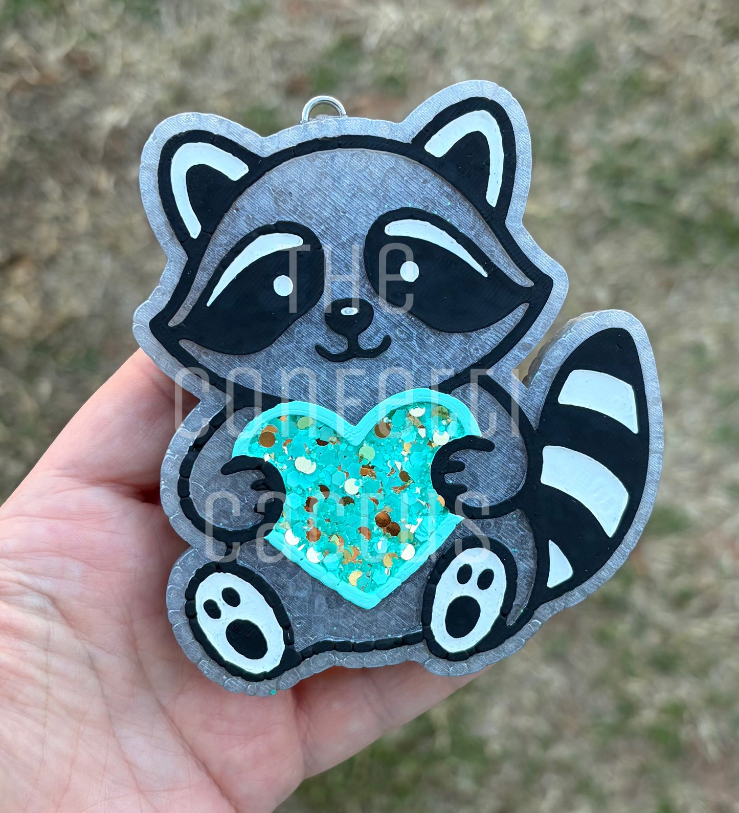 Raccoon holding a Heart