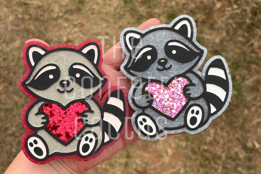 Raccoon holding a Heart